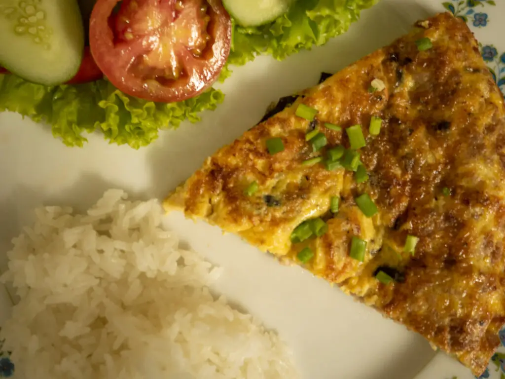 Vietnamese omelette served with Rice and salad